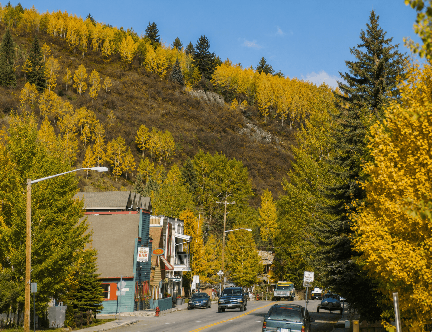 Main street of Minturn, Colorado with golden aspens and historic Cowboy Bar