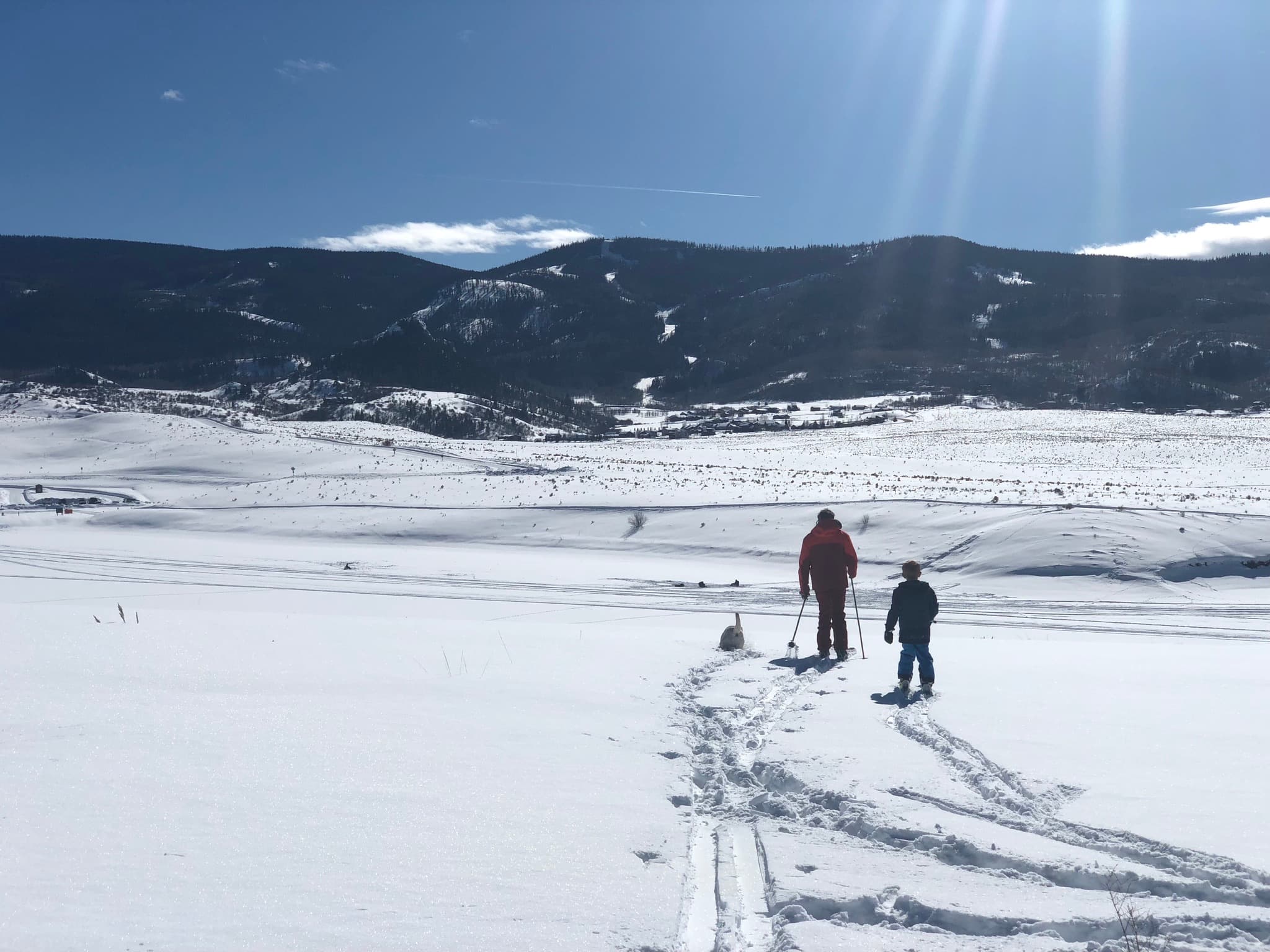 Cross-country skiing through snowy fields near Oak Creek, Colorado with mountain views